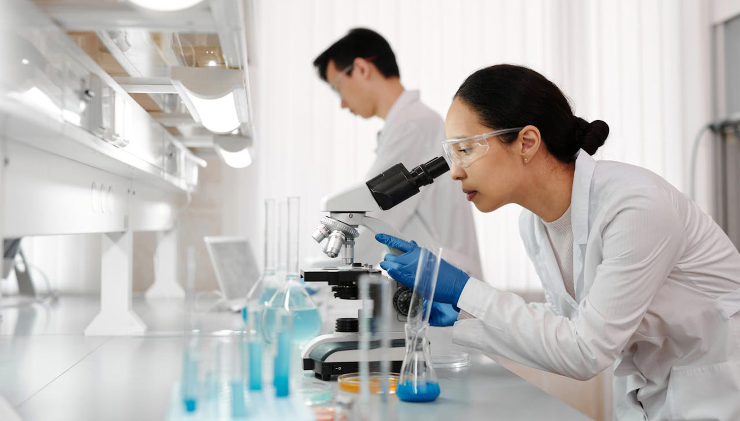 Researchers at a microscope